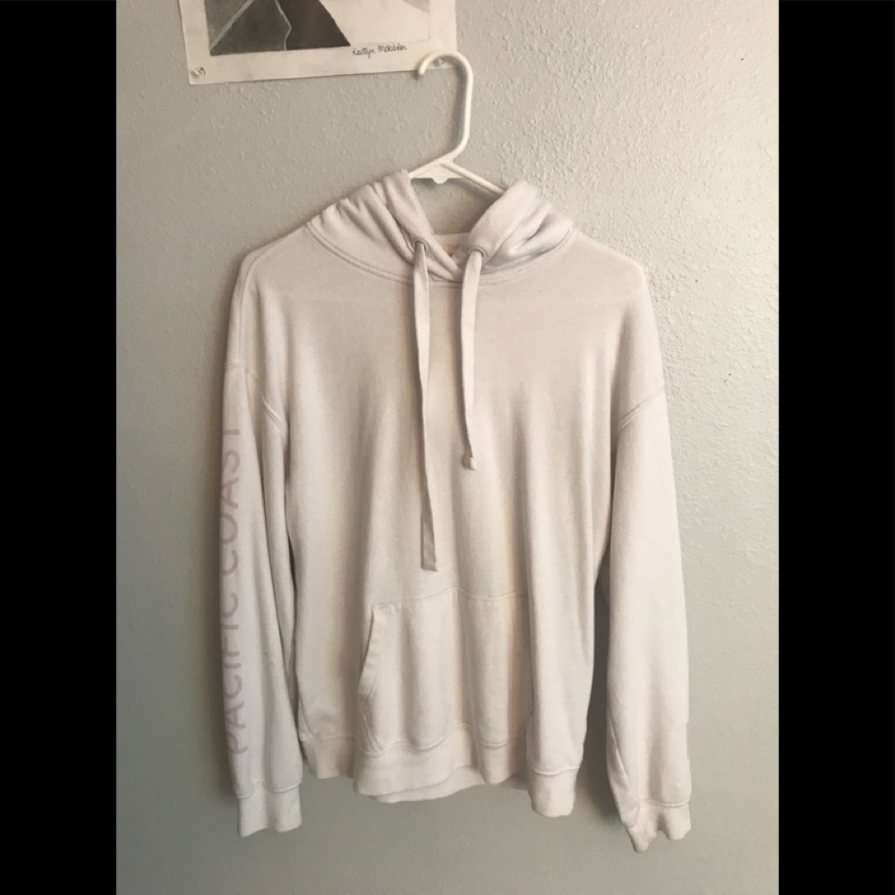 Garage white hoodie with purple/ pink designs.